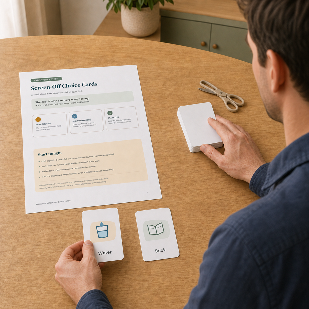 Father holding a Water choice card while preparing two familiar visual options