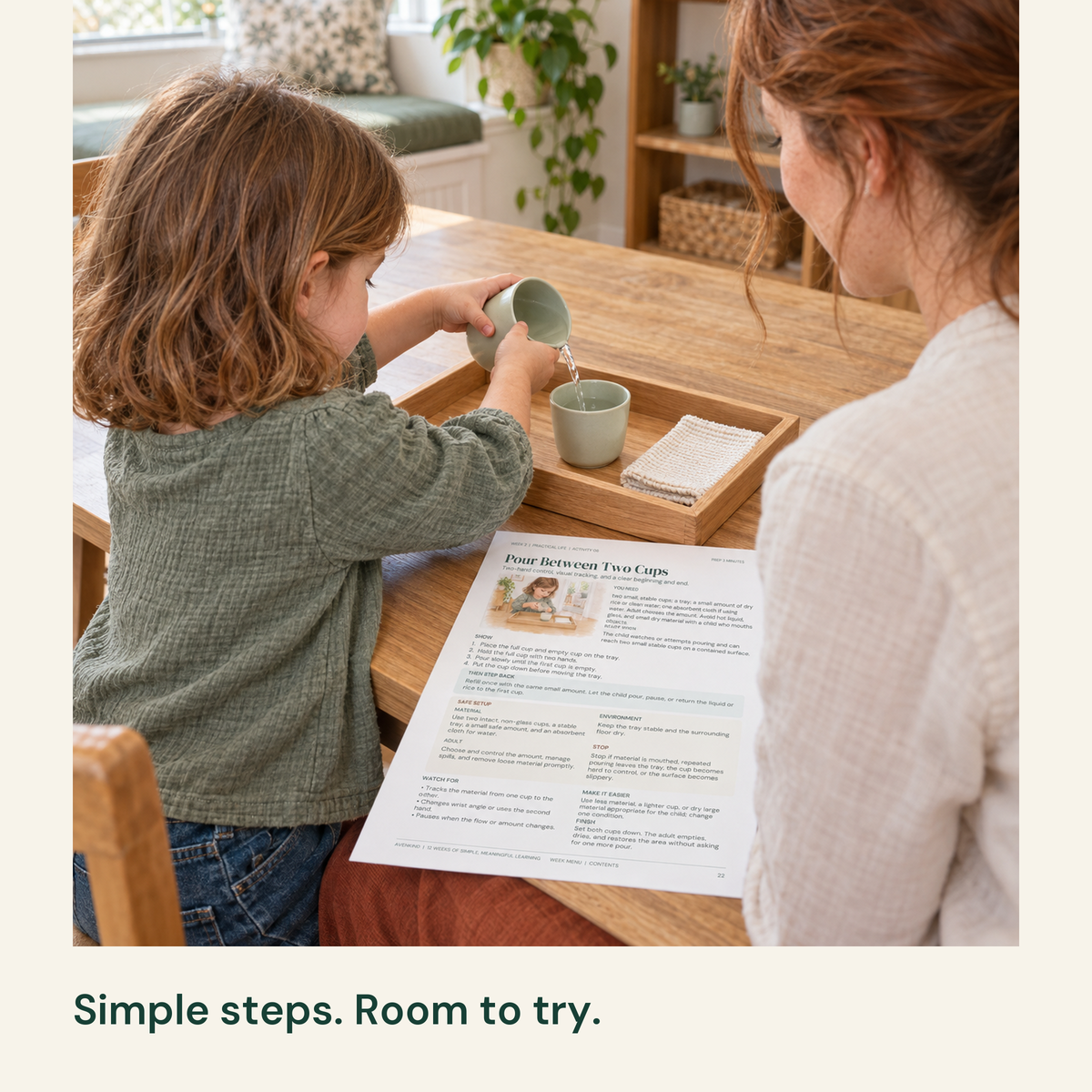 Child pours water between two cups in a shallow tray with the activity guide nearby.
