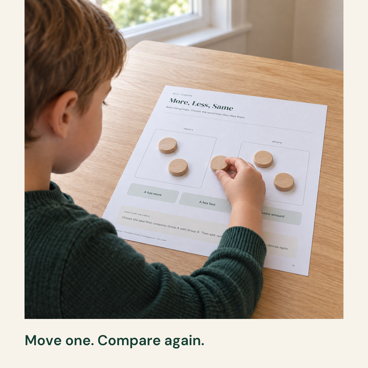 Child moving a large wood disc between Group A and Group B on More, Less, Same.