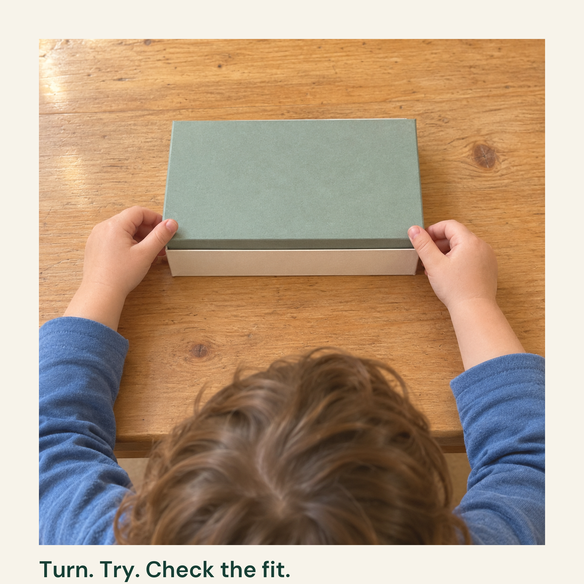 After turning the correct lid, a child gently tries it on its matching box and checks the fit. The household objects are not included in the digital guide.